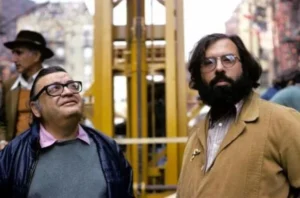 A side-by-side combined photo of author Mario Puzo and director Francis Ford Coppola, the creative minds behind decoding The Godfather.