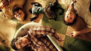 The Wolfpack in Bangkok from The Hangover Part II featuring Stu’s face tattoo, Alan’s shaved head, and the drug-dealing monkey.